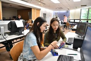 Alaska Tech Learners (ATL) is featured in ATE Impacts 2022-2023, with this photo of students learning web engineering.