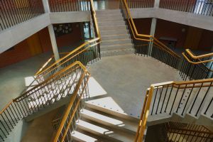 A photo of a community college staircase with stairs going different directions